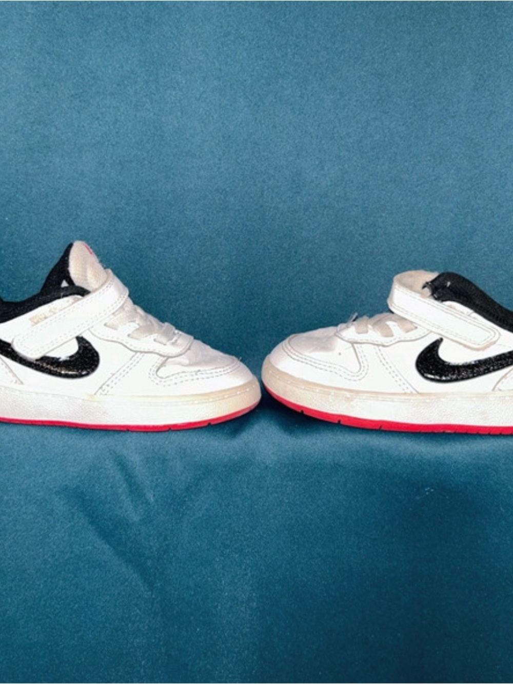 Nike Kids White Sneakers with Black Swoosh and Pink Outsole